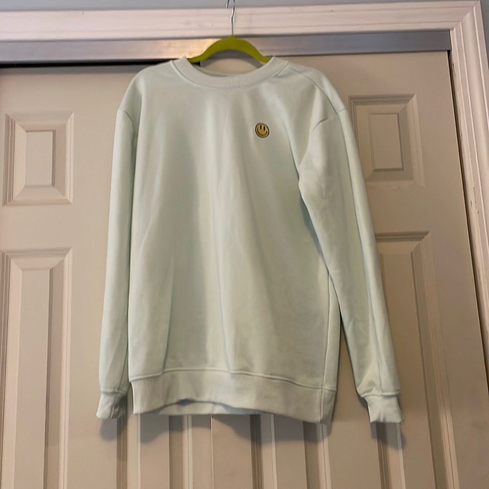 Embroidered smiley face sweatshirt